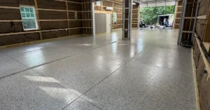 A finished flake epoxy garage floor in a clean, organized residential garage
