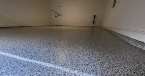 Flake epoxy garage floor with an epoxy base coat and polyaspartic topcoat